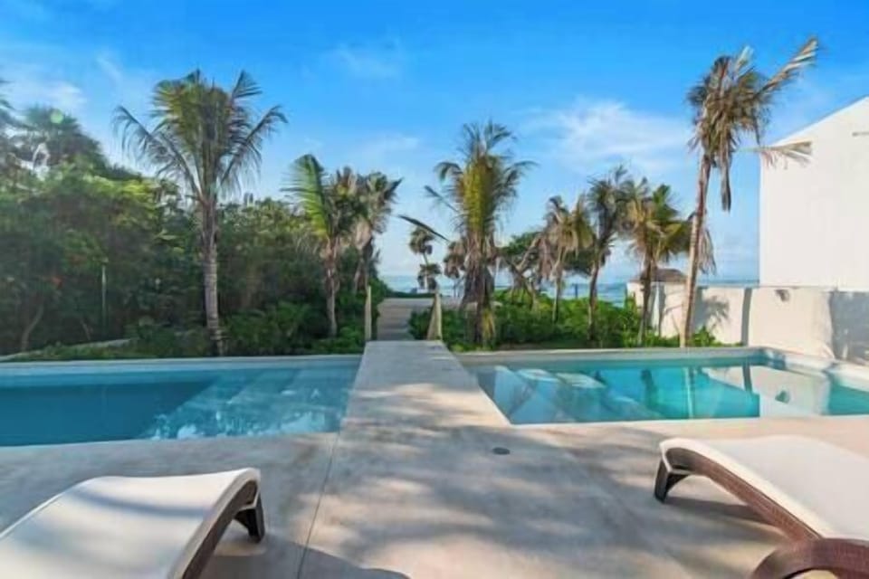 Discover paradise at our beach club with pools, umbrellas & beach access.
