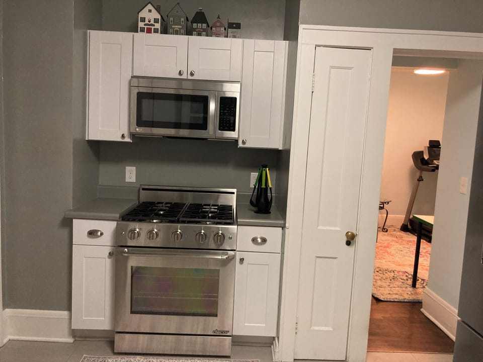 Large gas stove and oven. Bakeware, Pots & Pans, and Utensils.