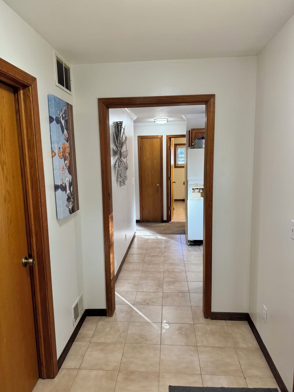 Hallway off mud room/ laundry room that leads into the kitchen 