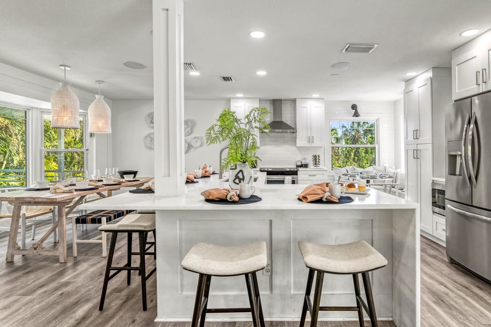 A generous island anchors the kitchen, perfect for casual bites before heading to the beach.
