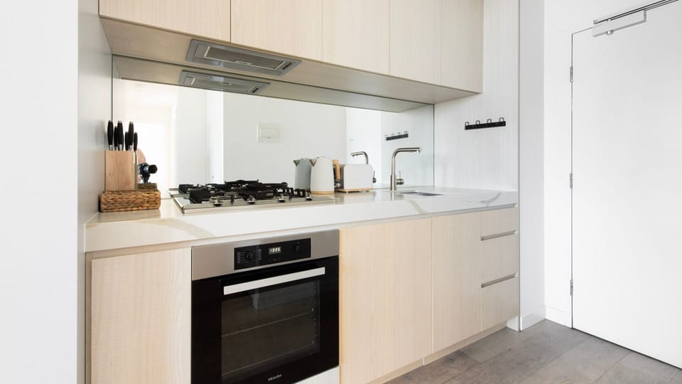 Fully equipped kitchen with gas cooktop and modern appliances