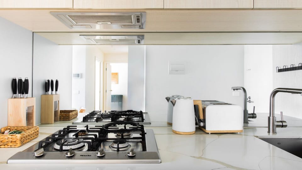 Sleek kitchen with everything you need for short or extended stays