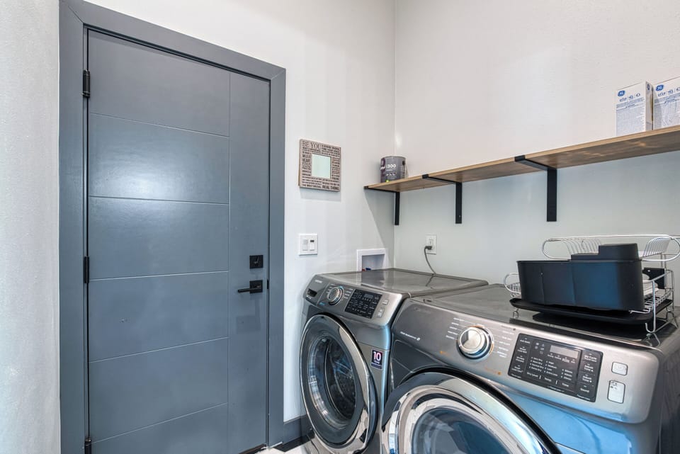 Full size washer and dryer for guests to use -- complimentary laundry detergent