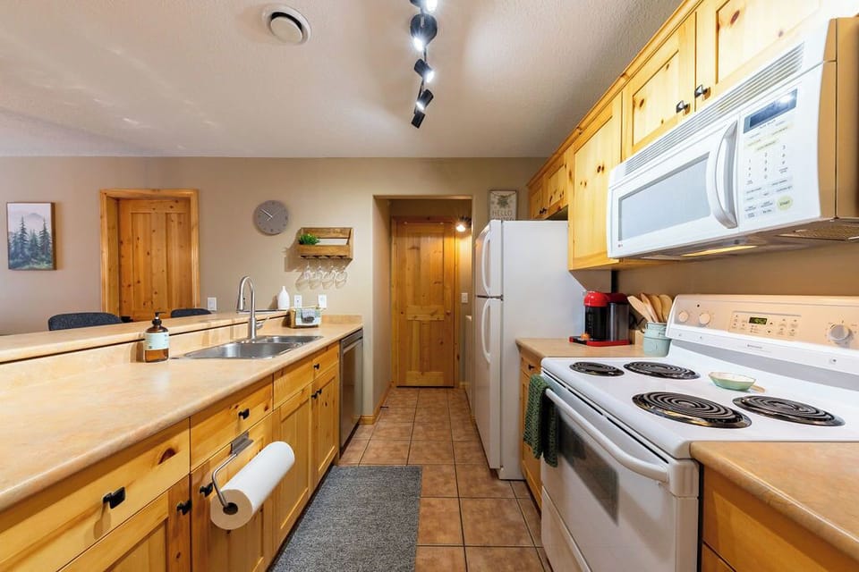 Open kitchen and dining layout keeps everyone connected