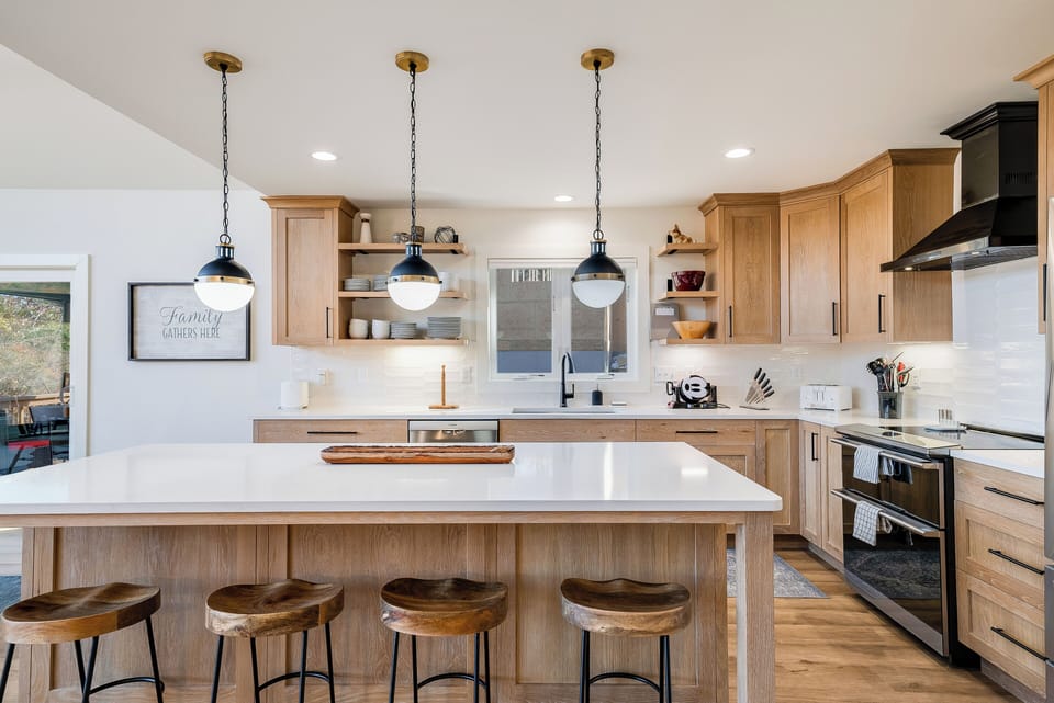 The heart of the home features a gorgeous, fully stocked kitchen with upgraded appliances, perfect for preparing meals and entertaining. Whether you're cooking a family dinner or enjoying a quiet meal, this kitchen has everything you need for a seamless experience.