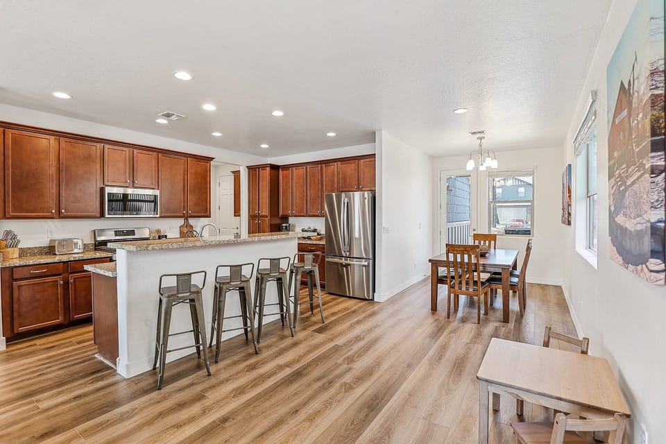 Fully Equipped Kitchen: Cook family meals with high-end appliances, a coffee bar, and seating options for everyone.