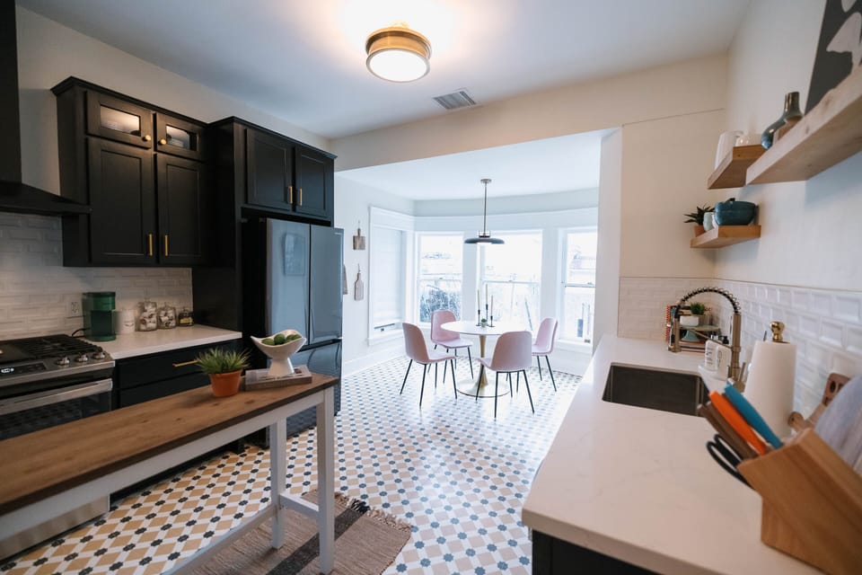 Down the hallway to your right is the spacious, fully stocked kitchen, perfect for cooking and entertaining.
