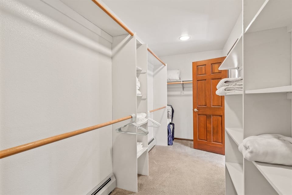 Primary Suite (Bedroom 1): Spacious room with a King bed, Crib, a very large walk-in closet and an oversized tiled walk-in shower, and a jacuzzi tub in the private en-suite bathroom.