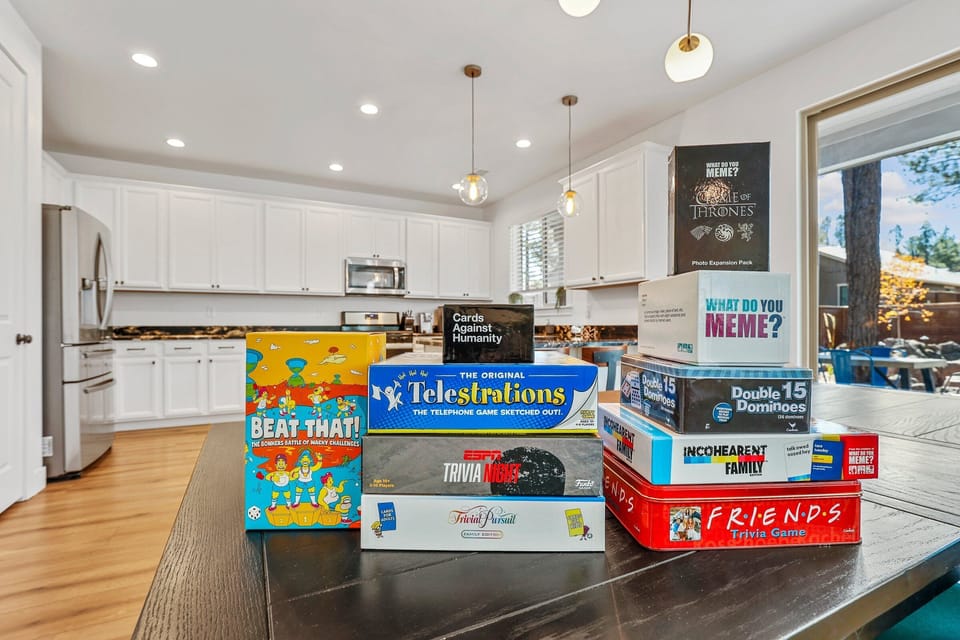 A curated collection of board and card games: Telestrations, Cards Against Humanity, Trivial Pursuit, What Do You Meme? Dominos, to name a few!