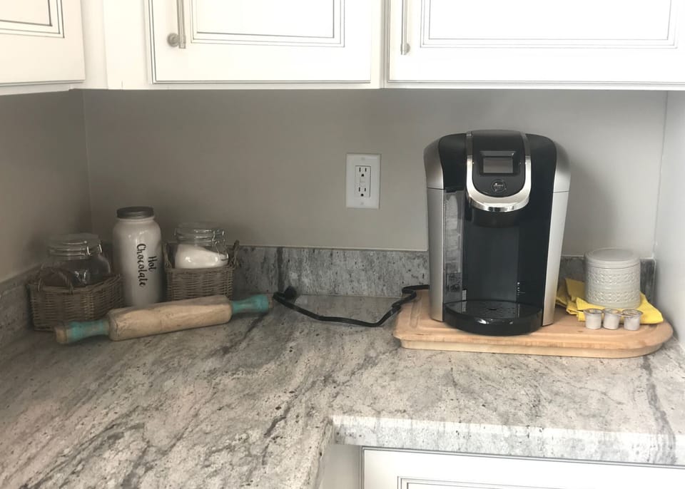 Stocked with serveware, a coffee maker, toaster, blender, and a variety of utensils to meet all your culinary needs, whether you're preparing a simple breakfast or a gourmet dinner.
