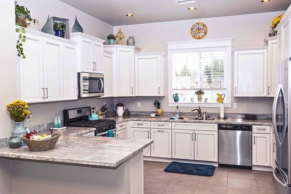 Fully Equipped Kitchen: Granite countertops, stainless-steel appliances, and all essentials needed to create home-cooked meals.