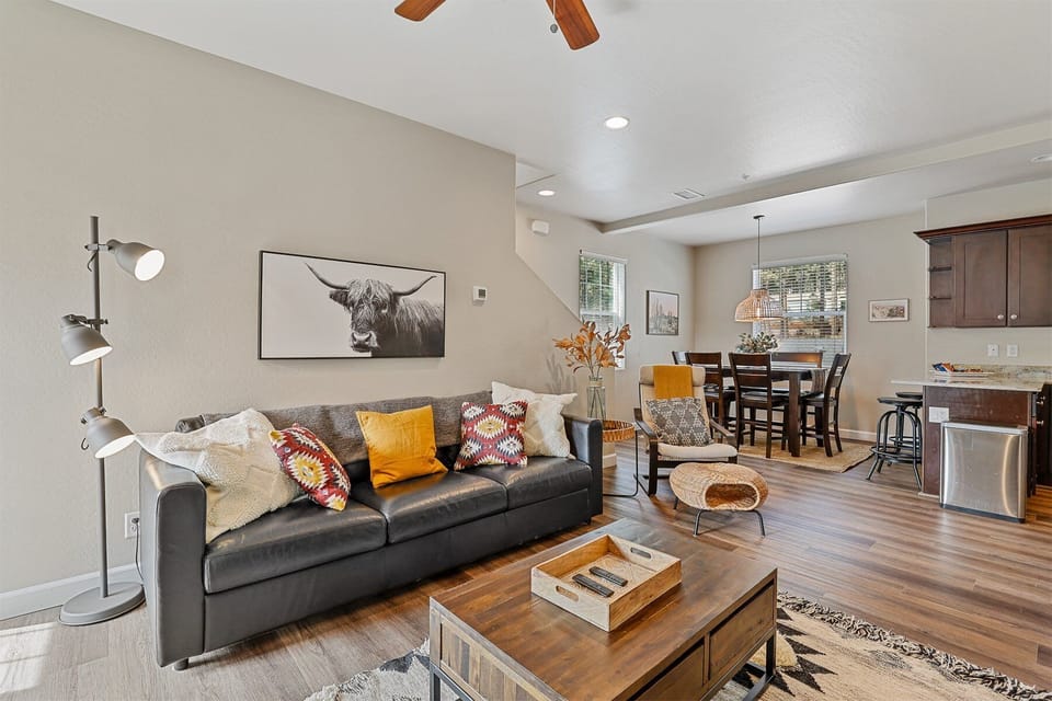 This spacious second-floor living area is designed for connection and relaxation, featuring 9-foot ceilings and a wide-open floor plan.