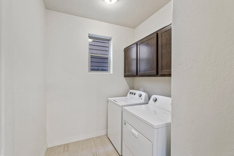 Laundry room with full size washer and dryer