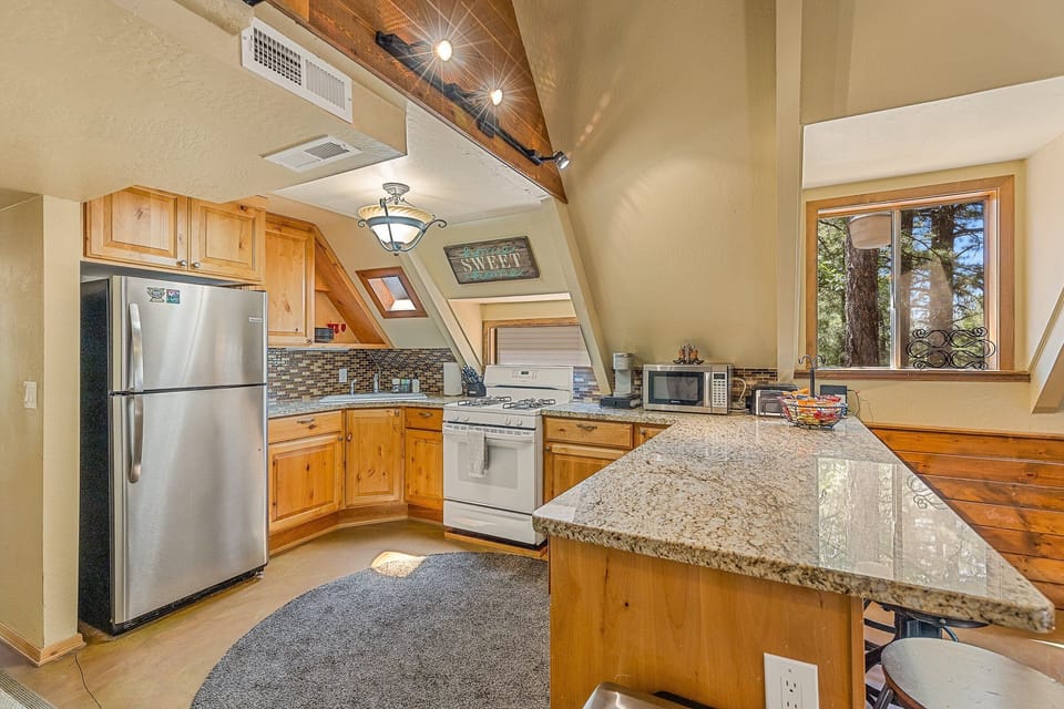Fully Equipped Kitchen: Prepare meals with ease using modern appliances and ample dining space.