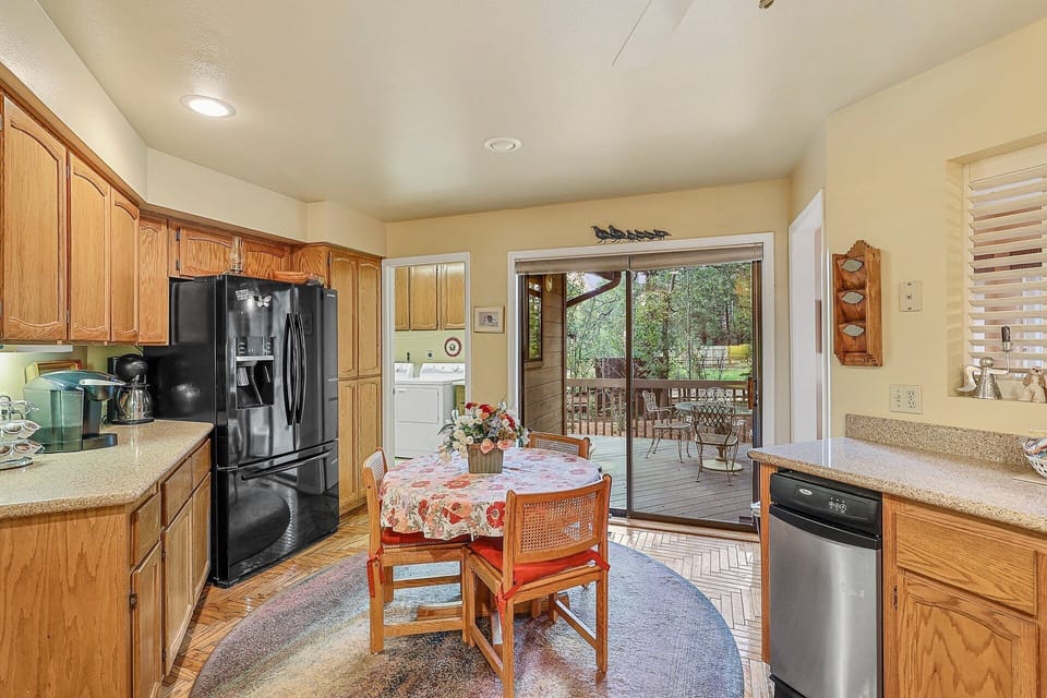 Stocked with modern appliances, including a stove, microwave, toaster, and Keurig coffee maker.