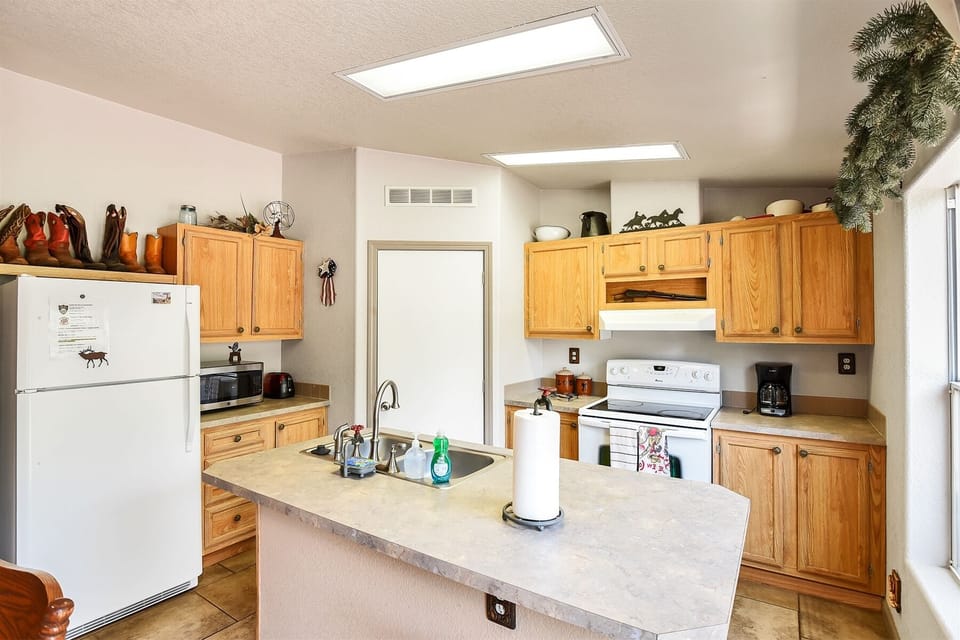 Fully Equipped Kitchen: Prepare meals with ease using a full range of kitchen essentials, including dishes, pots, and pans.