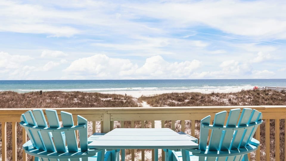 Sunset Place - Spacious deck with stunning beach views.
