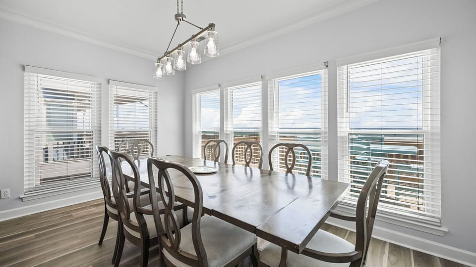 Sunset Place - Dining area with seating for eight, perfect for shared meals.