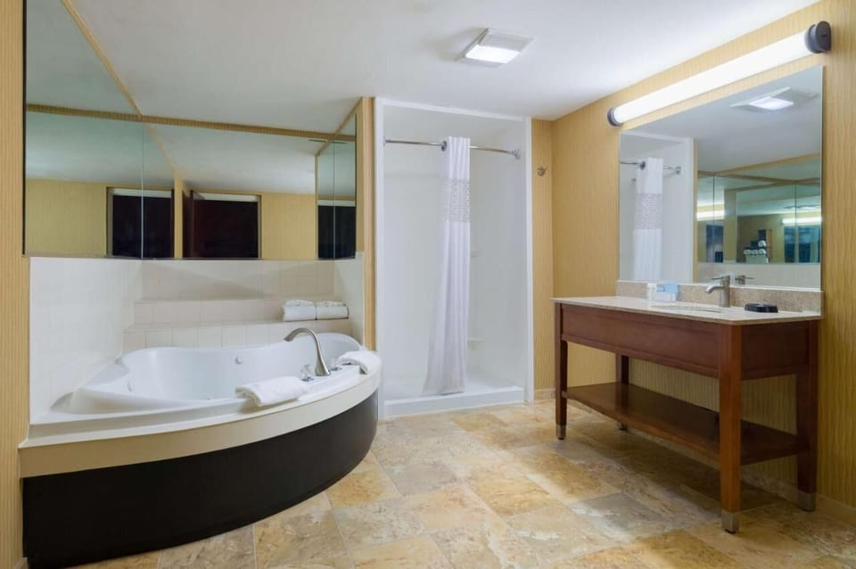 Sink into comfort with a spacious room and cozy sofa.