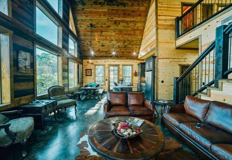 With tall ceilings and big windows, this living area feels open and airy, bringing the outdoors right inside.