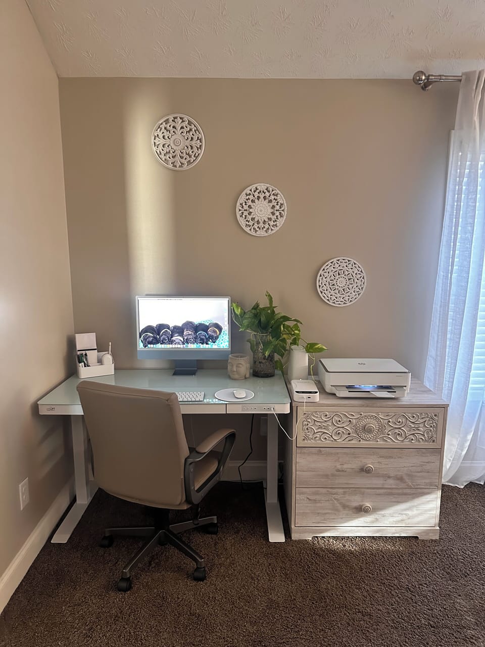 Need to get some work done? This sit and stand desk has a new iMac and printer!