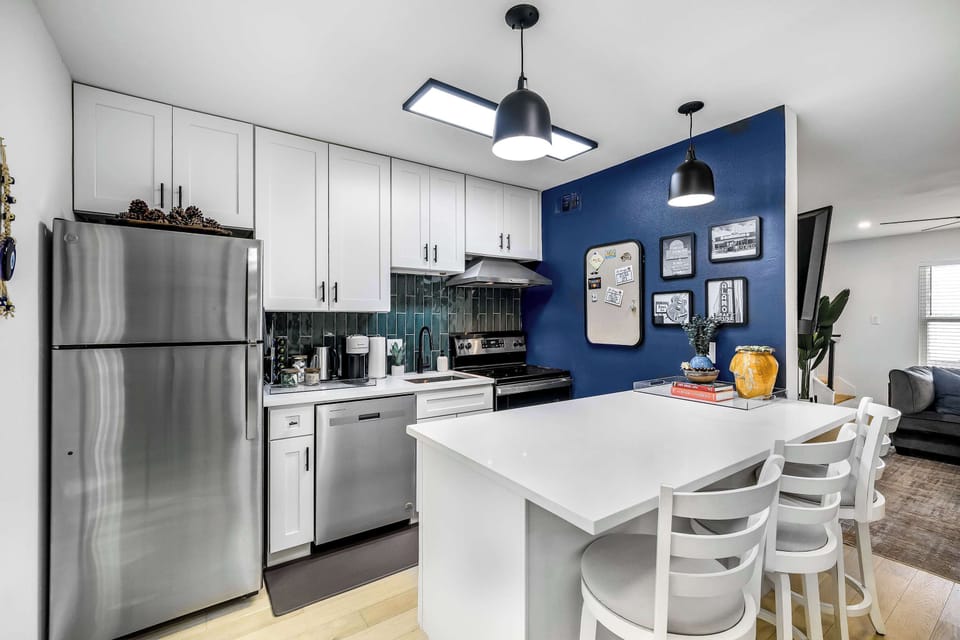 Full kitchen with that blue accent wall you'll actually remember.