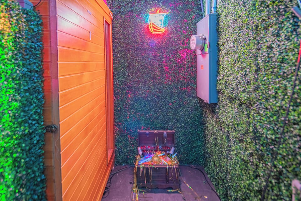 Cozy nook with green wall privacy and a hidden treasure chest to discover.