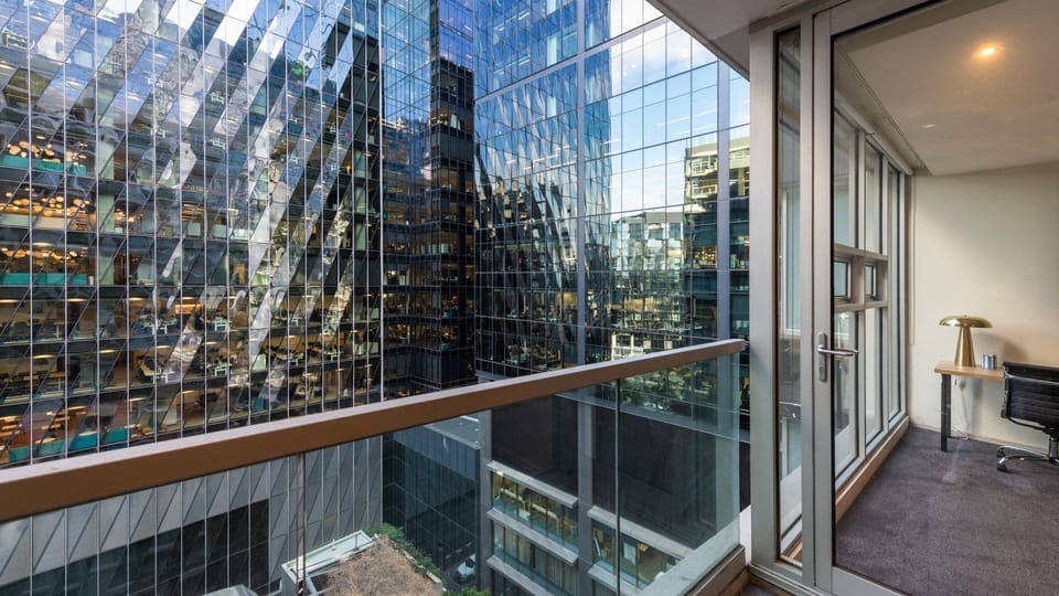 Step onto your private balcony to take in the striking architectural views of the city.