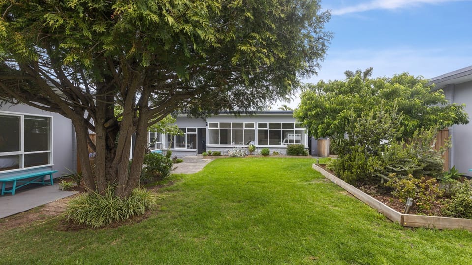 Shared garden courtyard with lawn and seating
