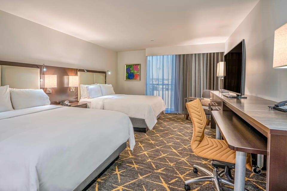 Settle into crisp linens and enjoy space to truly relax.