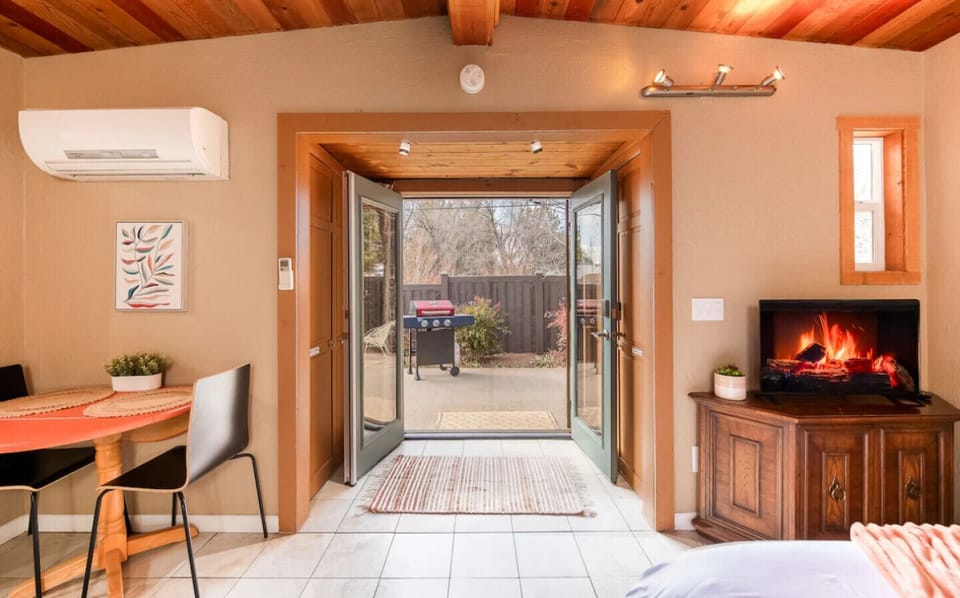 Step into seamless indoor-outdoor living with door that open to your private patio. Enjoy fresh air, grill out, or cozy up inside by the electric fireplace—comfort and convenience all in one inviting space.