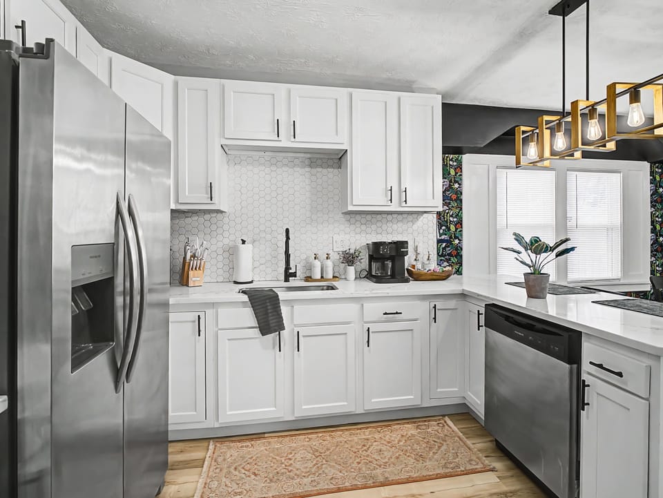 Clean white kitchen w/ stainless appliances & plenty of counter space
