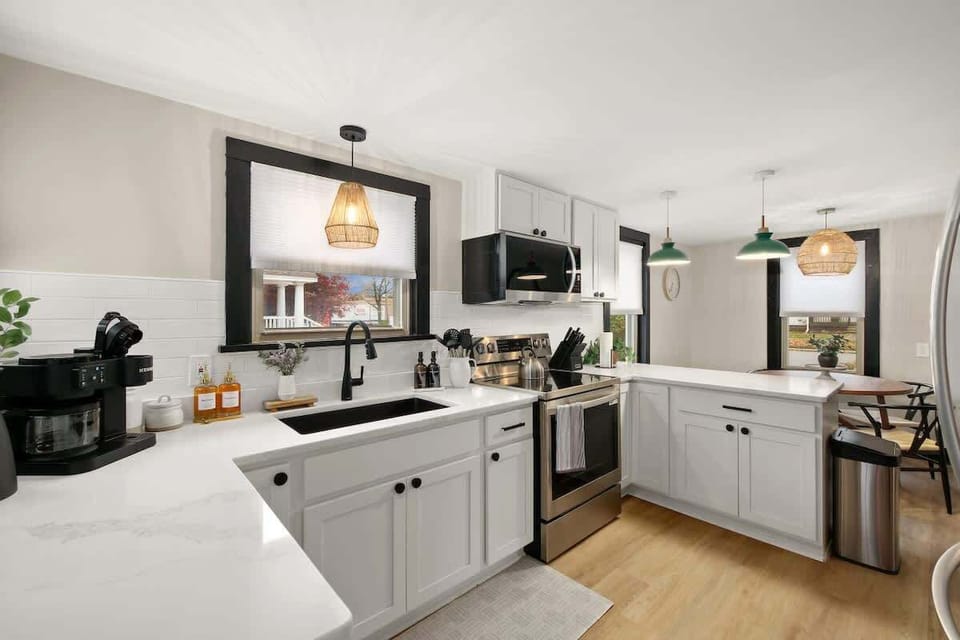 Modern kitchen w/ stainless appliances, bright cabinetry & clean finishes
