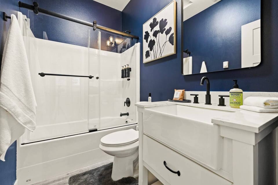 Upstairs full bathroom with sliding glass doors