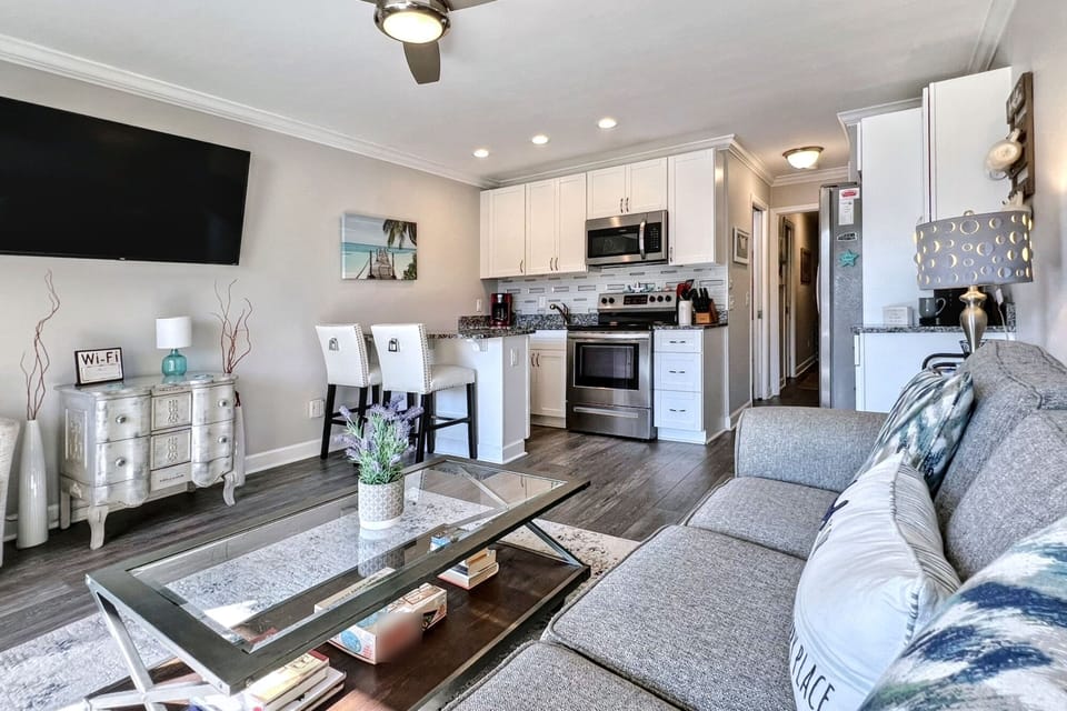a fully equipped kitchen with pots, pans, utensils and linens.