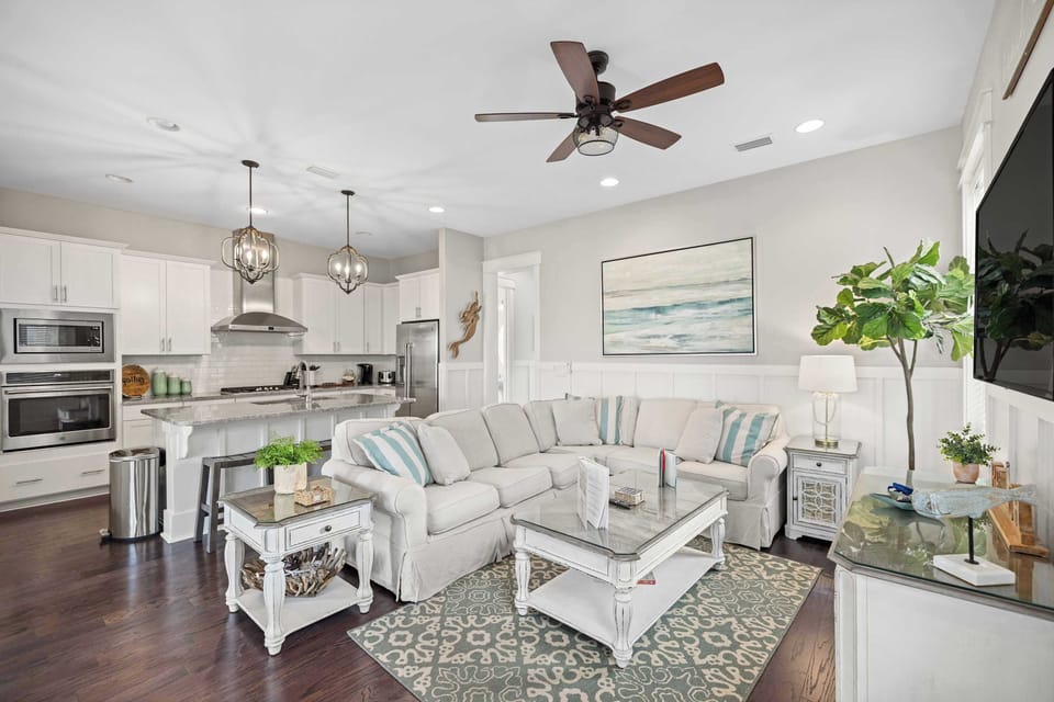 Main living space: Bright and open layout, living room, fully equipped kitchen, and dining room, 55” Smart TV w/cable, 7-person dining table