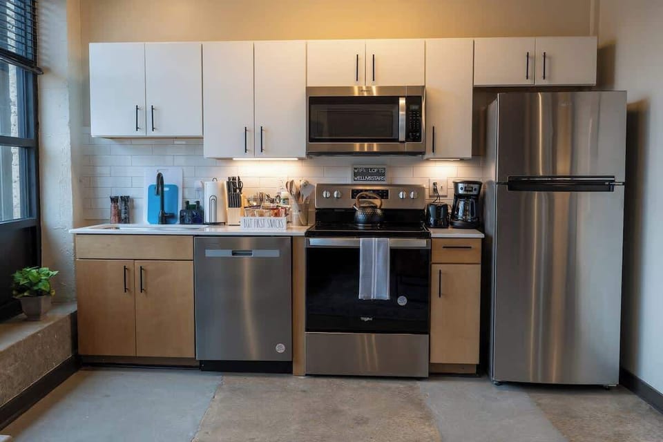 Modern kitchen with stainless steel appliances and cabinets