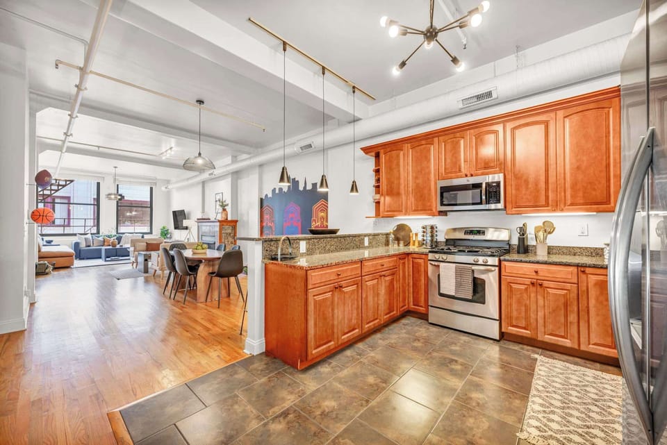 A well-planned layout where the kitchen and living room seamlessly blend together, encouraging connection, conversation, and togetherness throughout the home.