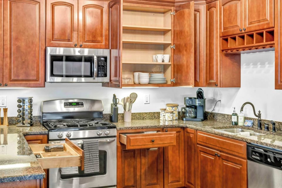 This kitchen is designed with practicality in mind, featuring accessible appliances that make meal preparation easy and convenient for guests.