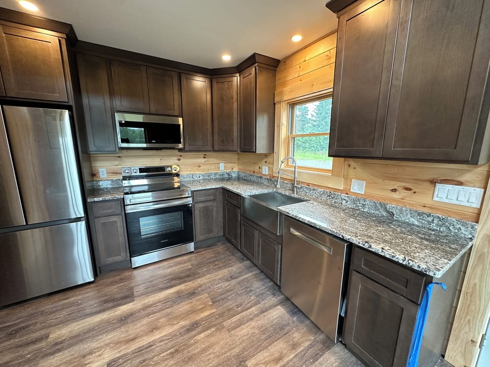 Full kitchen with all new appliances, and filtered spring water