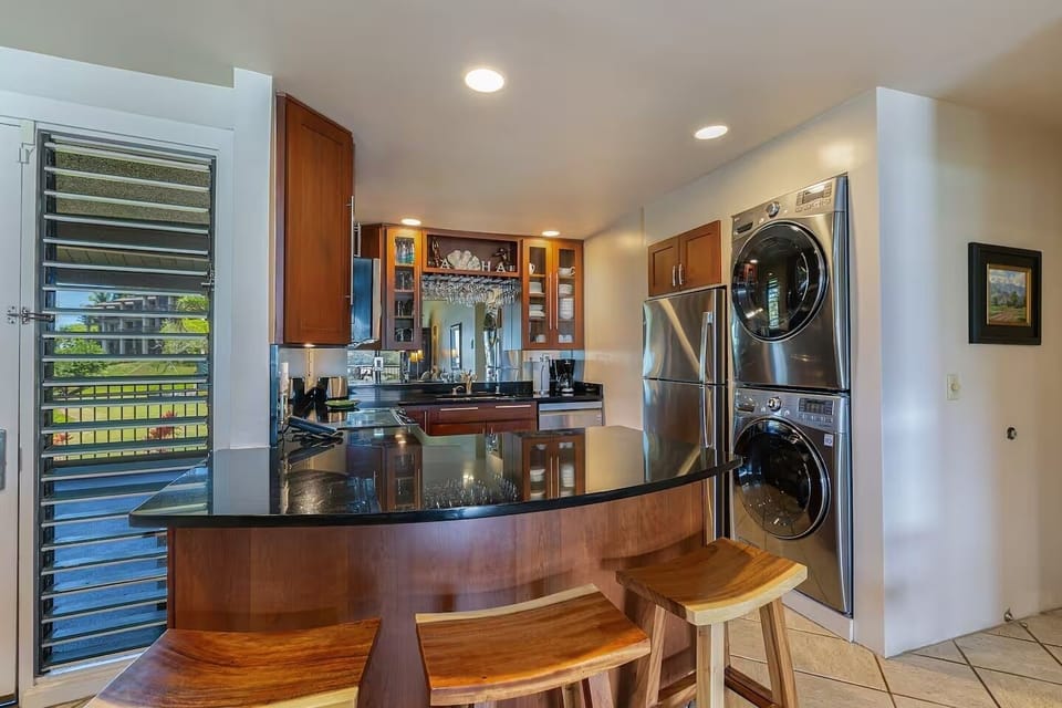 Conveniently prep meals in the fully-equipped kitchen with bar seating for three.