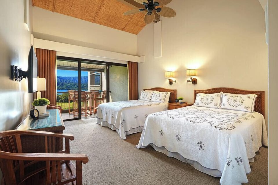 Bedroom has two queen beds, TV and private lanai.