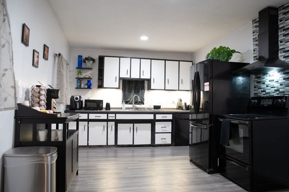 Where culinary dreams come to life: sleek kitchen, coffee bar, and all the essentials.