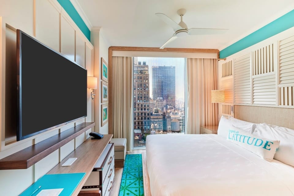 Wake up to skyline views in crisp, coastal-styled comfort.