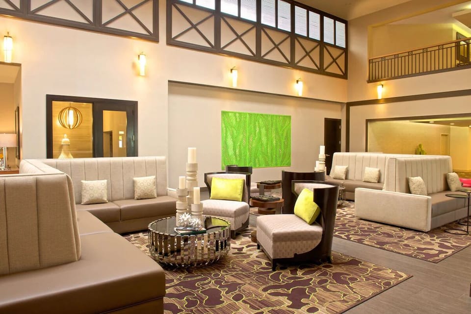 Linger with friends in a bright, stylish lobby lounge.