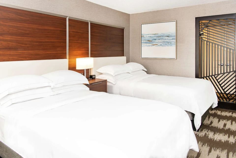 Stretch out and recharge on plush beds with modern finishes.