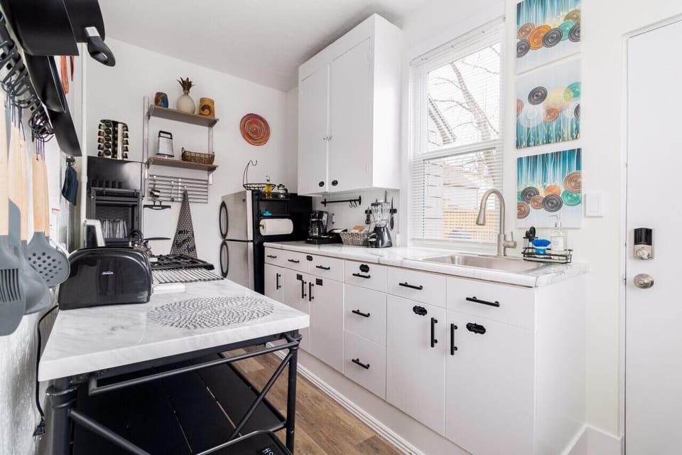 The kitchen's layout is functional and efficient, maximizing space.