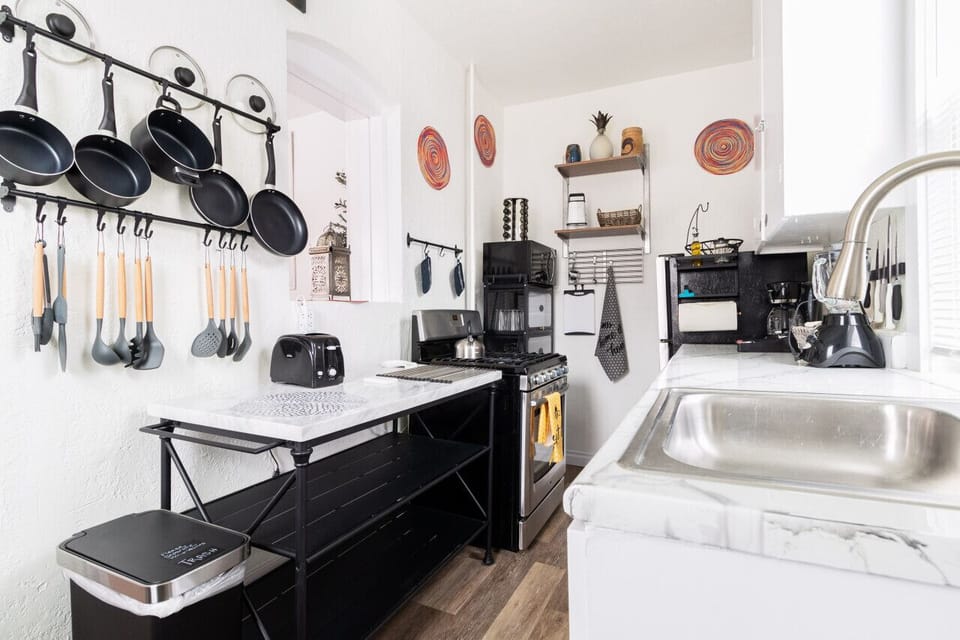 A well-equipped kitchen, showcasing a mix of modern and eclectic elements.