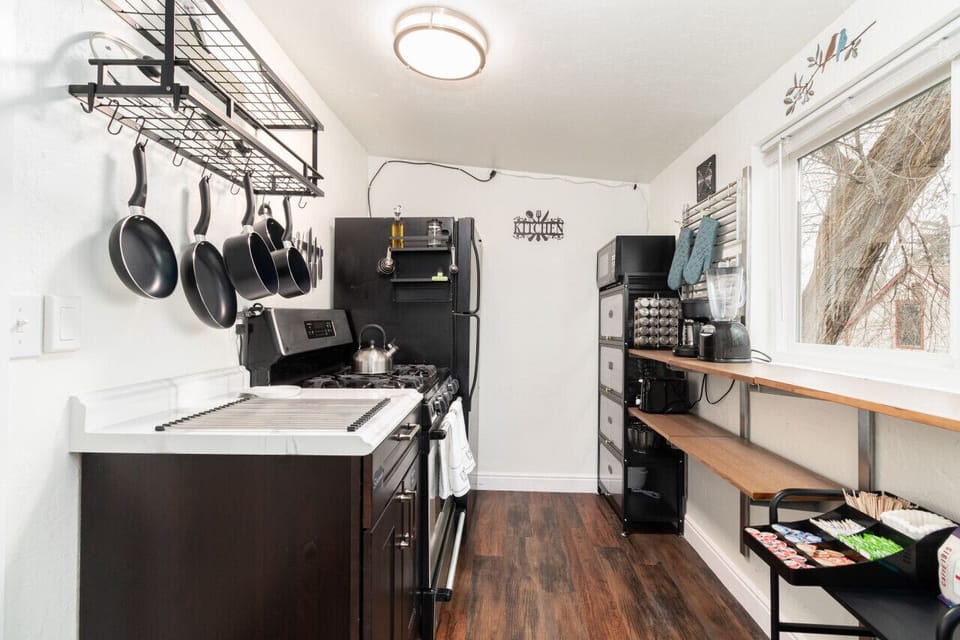 A compact, well-equipped kitchen, perfect for a quick meal or a cozy morning coffee.
