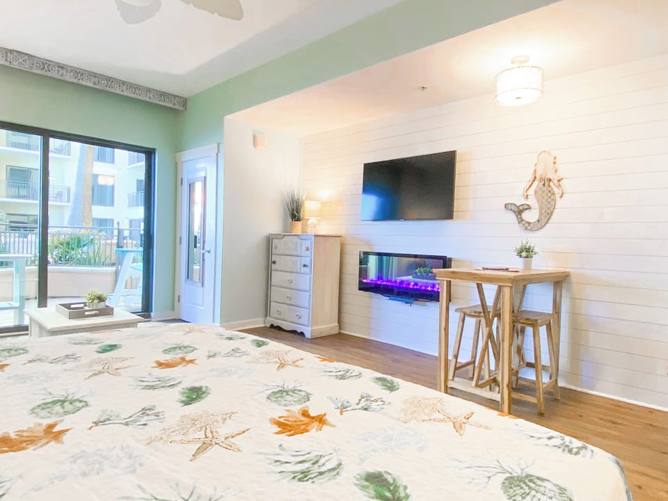 Beautifully updated unit featuring a large flat screen TV + electric fireplace!